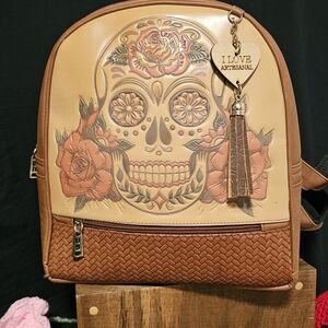 Artisan Brown and Tan Backpack with Intricate Skull Design